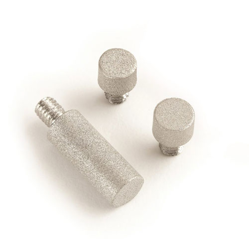 Three metallic cylindrical objects with knurled tops, one larger with a threaded end, possibly standoffs or spacers, isolated on a white background.