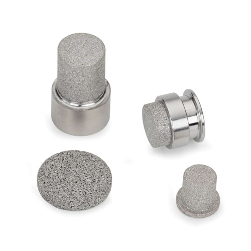 Four metal implants with textured surfaces on a white background.